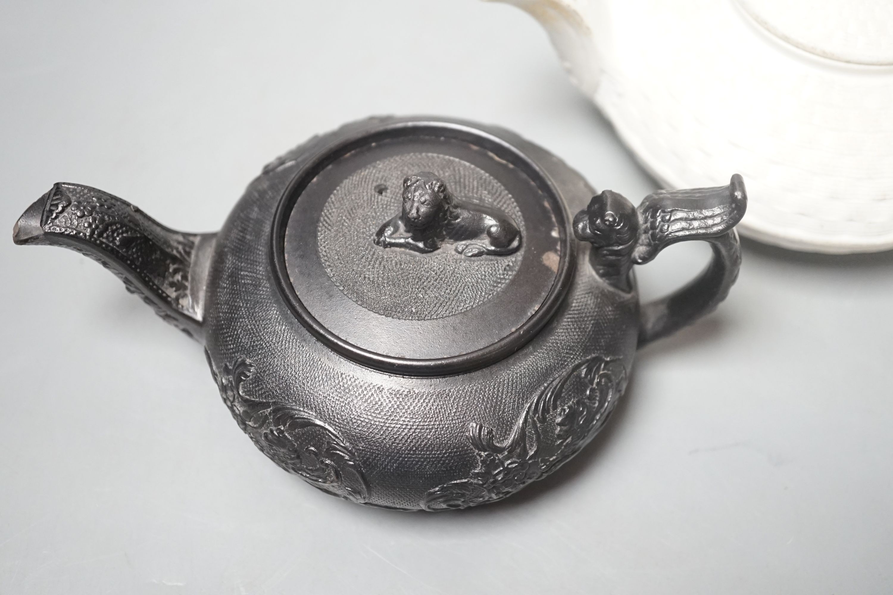A Wedgwood caneware teapot c.1810 and an English black basalt teapot c.1810